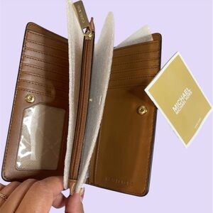 Michael Kors Monogram Cream and Gold Clutch New without tags